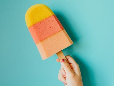 Colorful ice cream on blue background